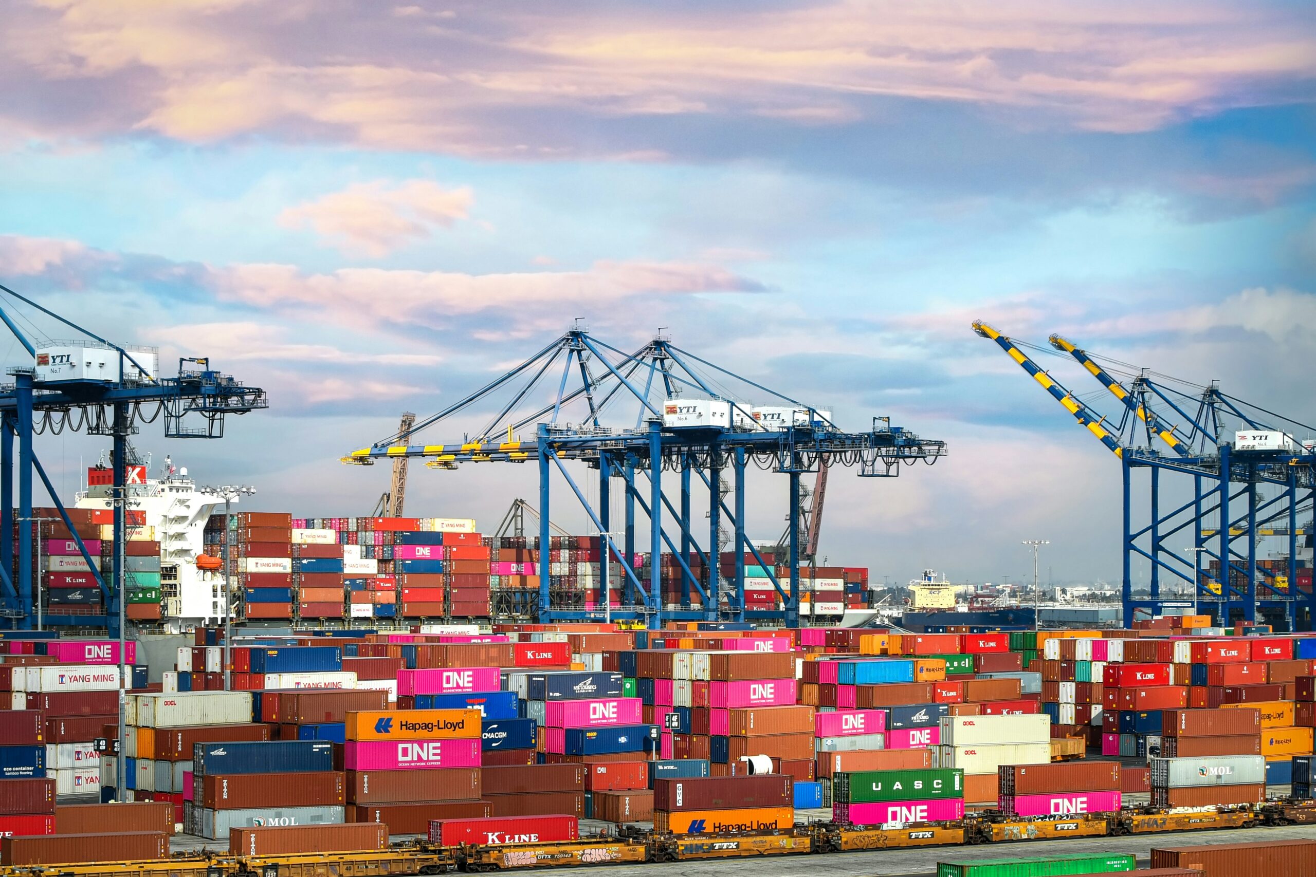 Shipping containers at a port, illustrating global trade and logistics.
