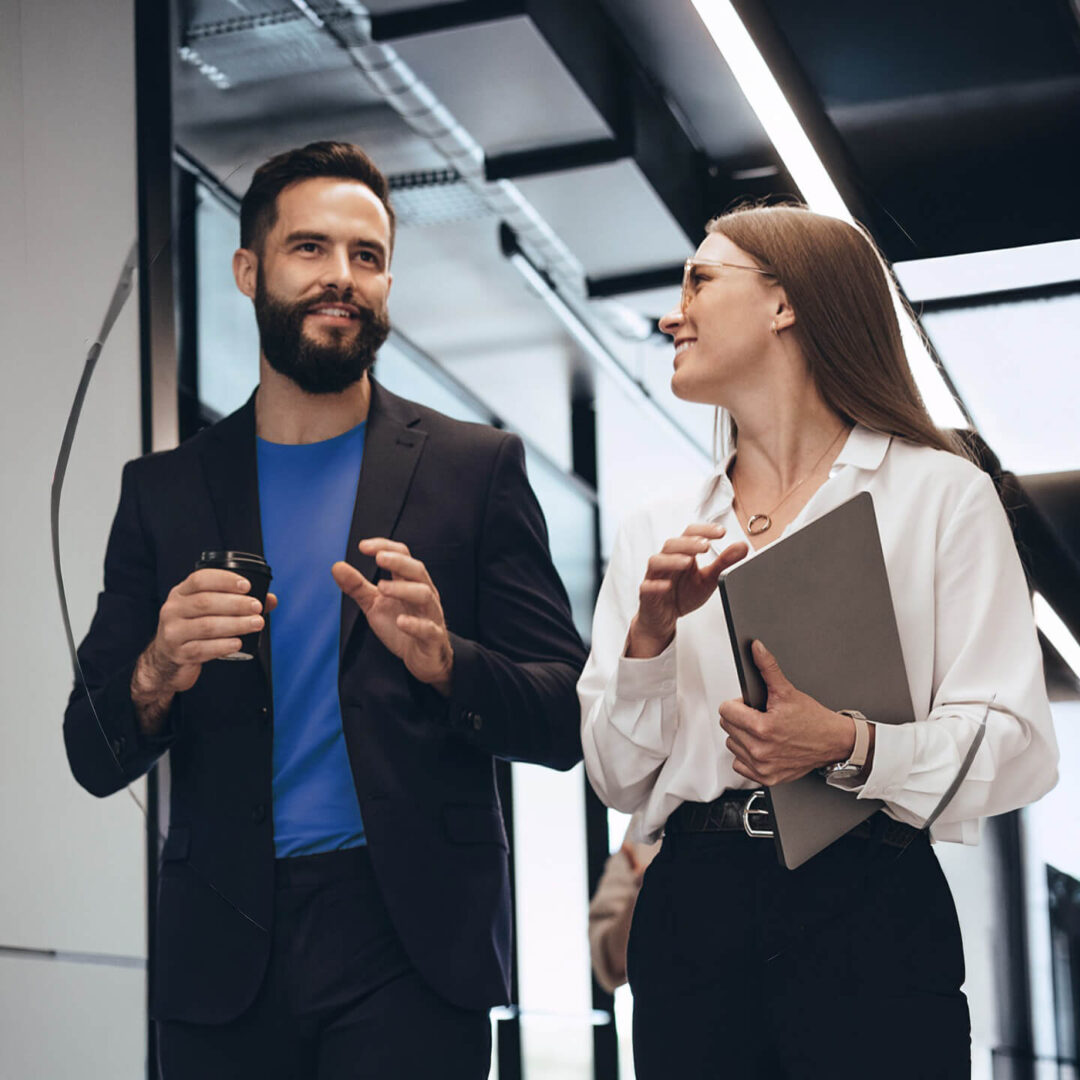people walking in an office setting